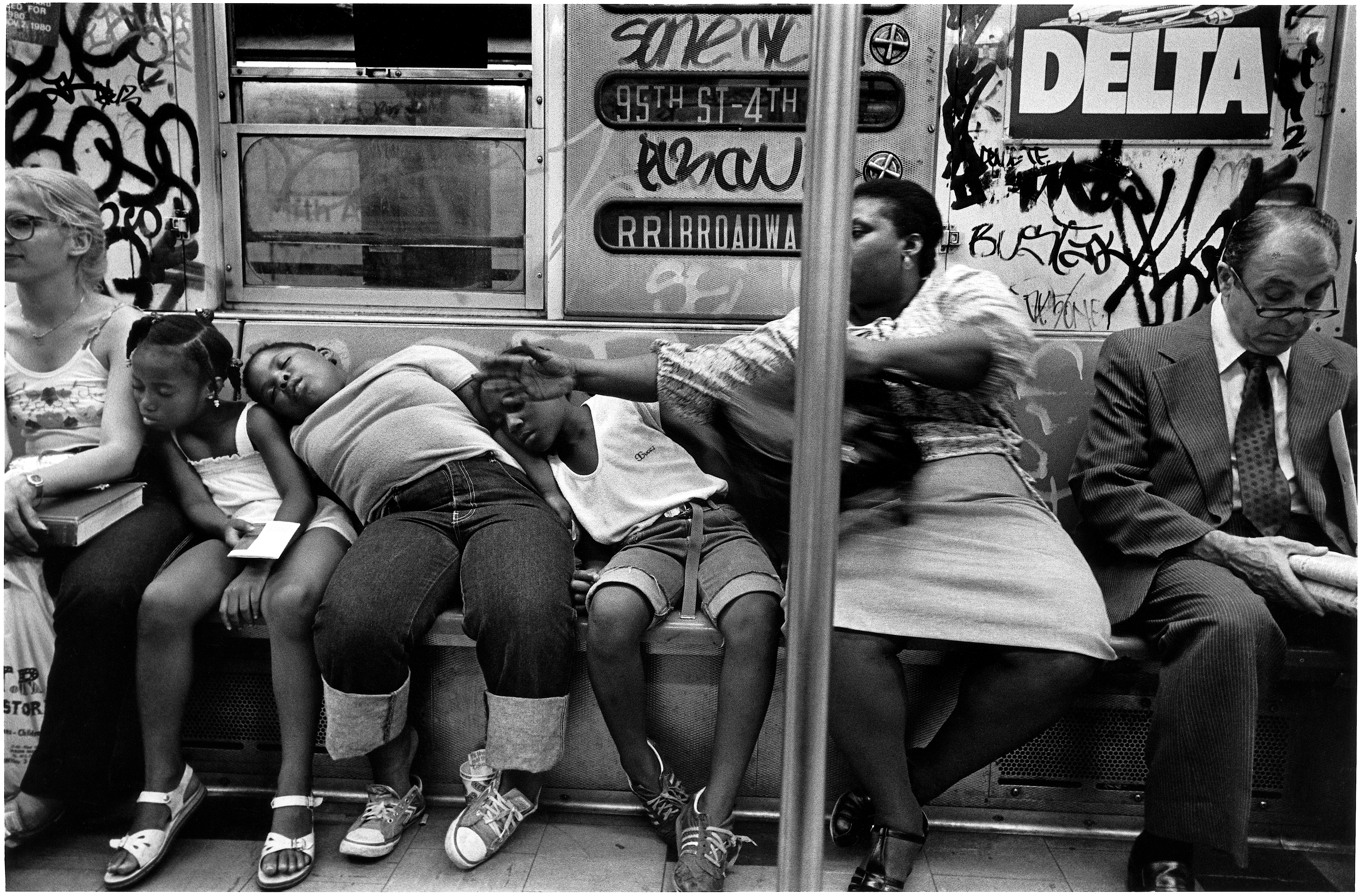 Kids asleep on woman in subway, 1981 Richard Sandler Photography