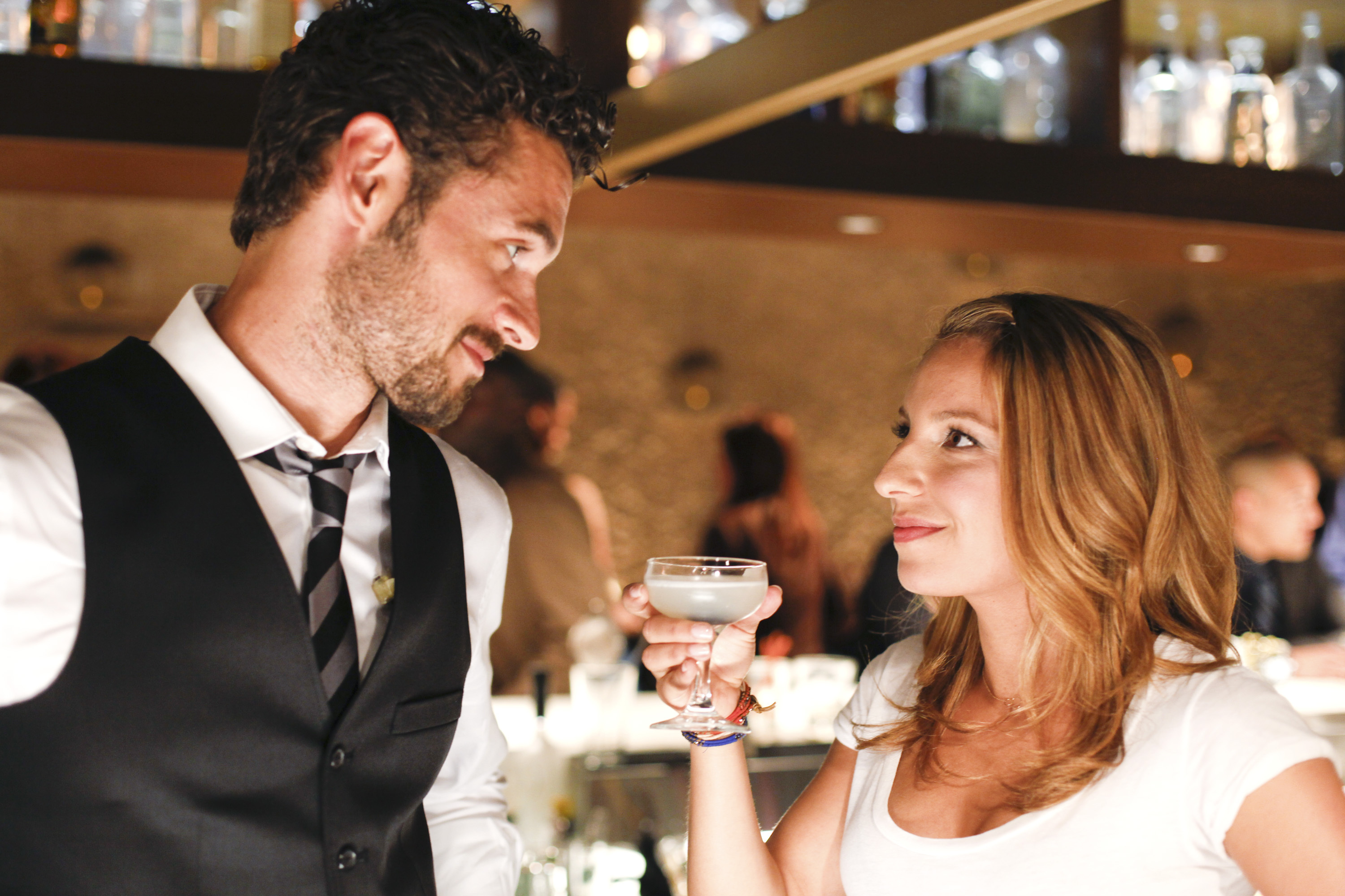 Sexy bartender Dominic (Adan Canto) and cocktail waitress Kacey (Vanessa Lengies) share a moment. (Mixology).