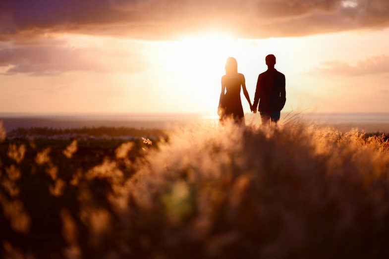 a href="http://www.shutterstock.com/pic-183188573/stock-photo-young-couple-enjoying-the-sunset-in-the-meadow.html?src=psdY4I_Pa6tn4Iw9bCM9lw-1-23">Shutterstock