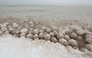 Lake Michigan Looks Like A Giant Bowl Of Cocoa Puffs With All Of These Ice Balls Floating Around