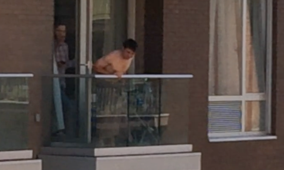 Almost Naked Privileged Idiot Harasses People From Balcony Of Williamsburg Condo