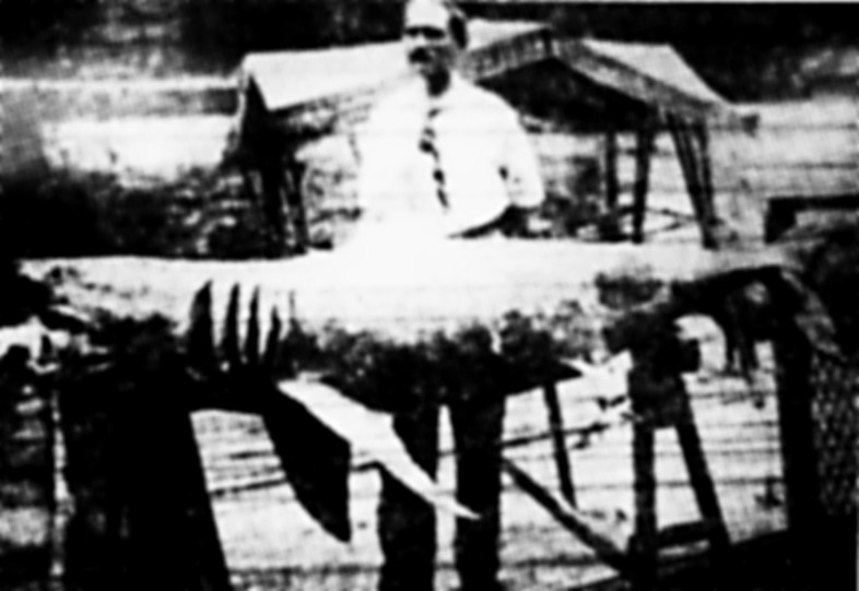 Michael Schleisser posing with a young white shark that may have been responsible for some of the infamous July 1916 attacks in New Jersey. (Wikimedia Commons)