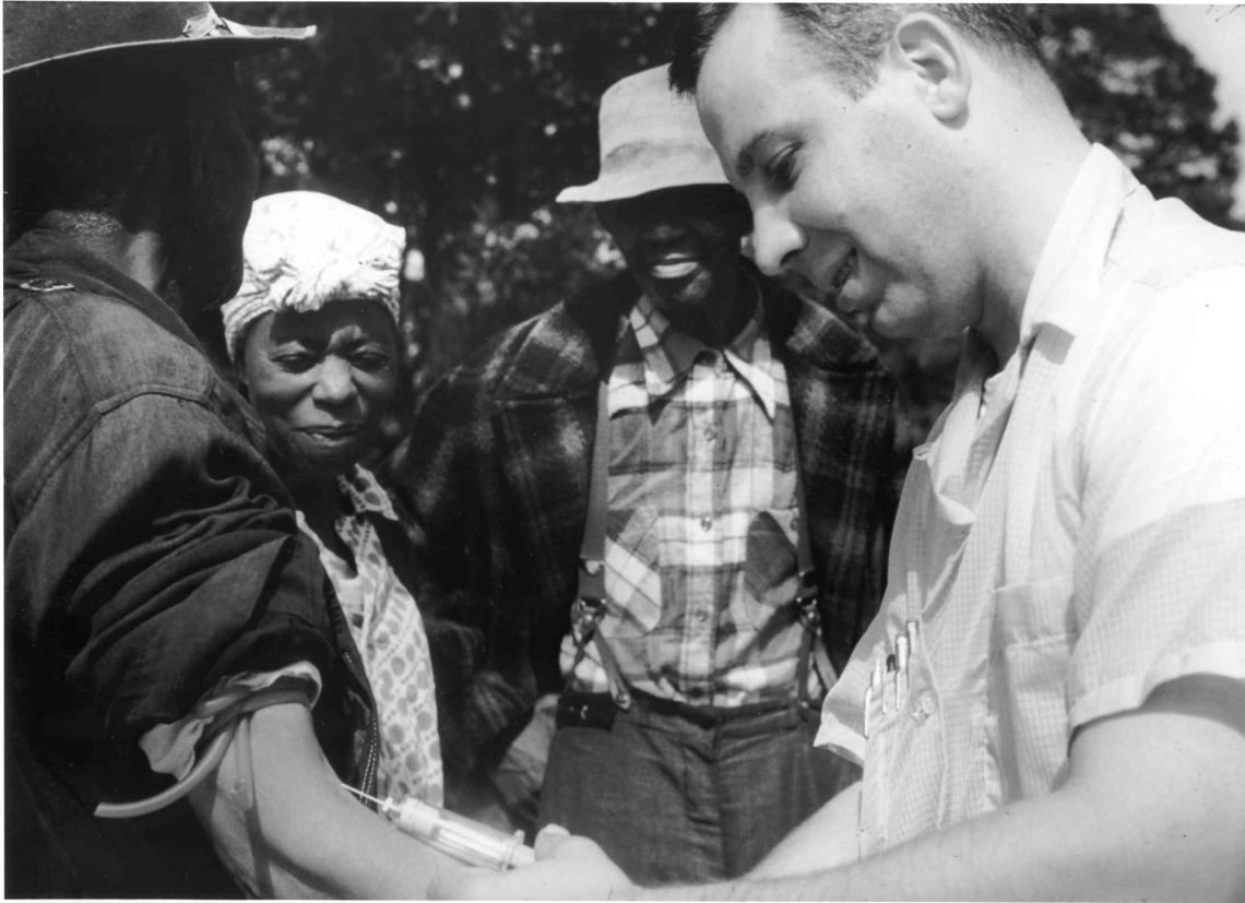 A doctor draws blood from one of the Tuskegee test subjects.