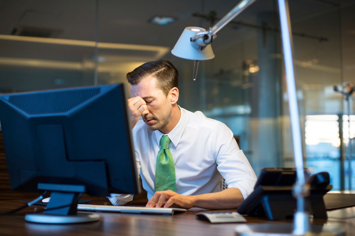 Business man overwhelmed with work
