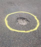 yellow circle pothole