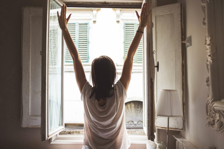 https://www.pexels.com/photo/person-in-white-shirt-standing-in-front-of-window-36079/