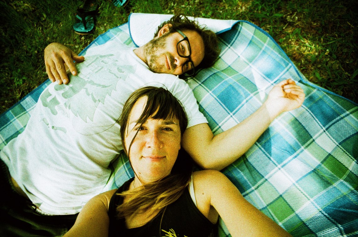 couple laying down, happy couple, what it means to be in love, being in love