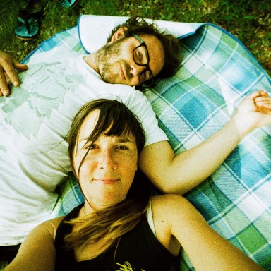 couple laying down, happy couple, what it means to be in love, being in love