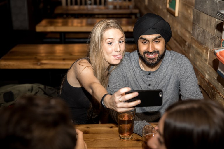 problem with modern dating, couple taking a selfie,