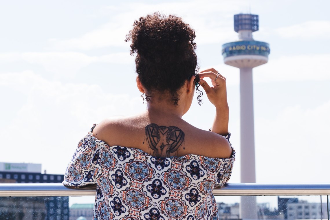 Woman looking over view