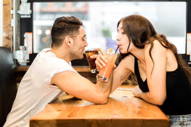 Cute couple drinks a milkshake