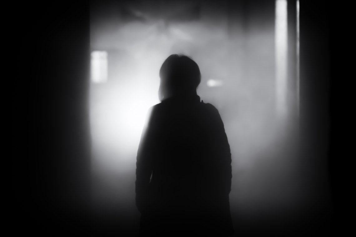 Person walks into a dark, scary room