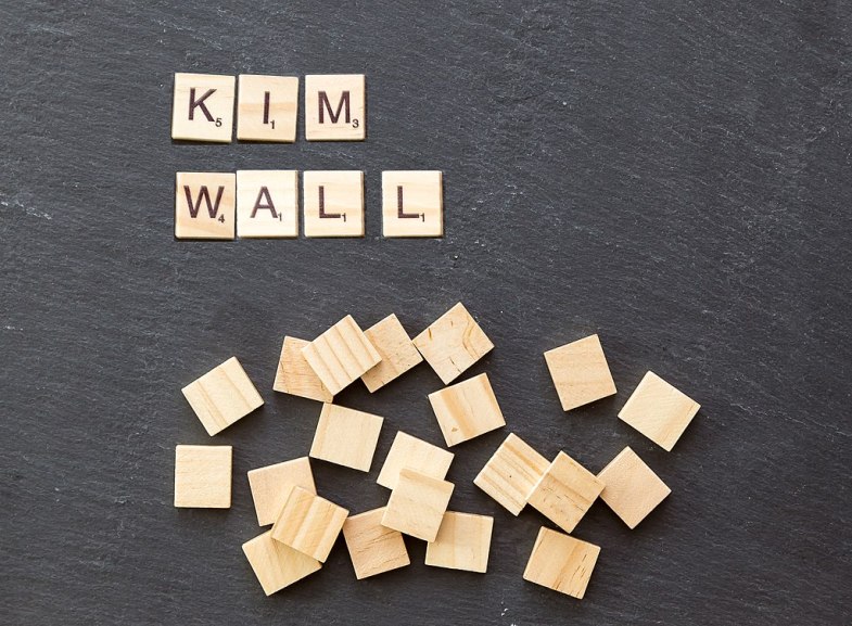Scrabble pieces spell out "Kim Wall" name