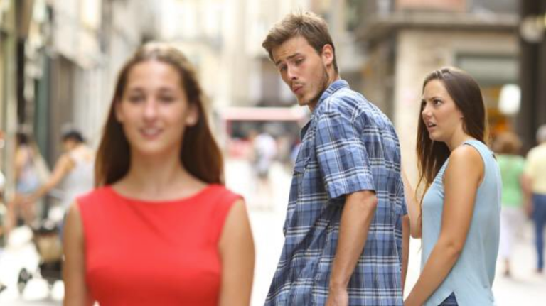 This man checks out another girl while his girlfriend looks at him incredulously in this viral meme