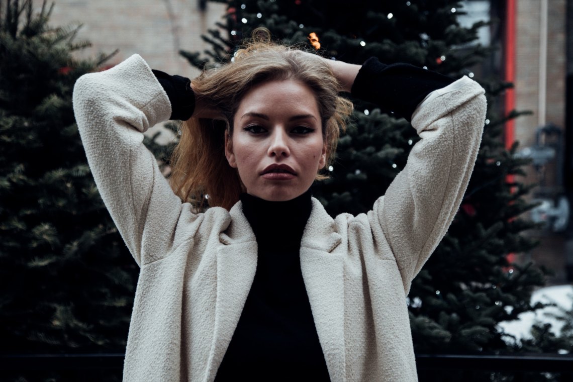 Girl running fingers through her hair