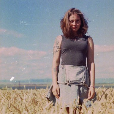 Girl Standing In Field