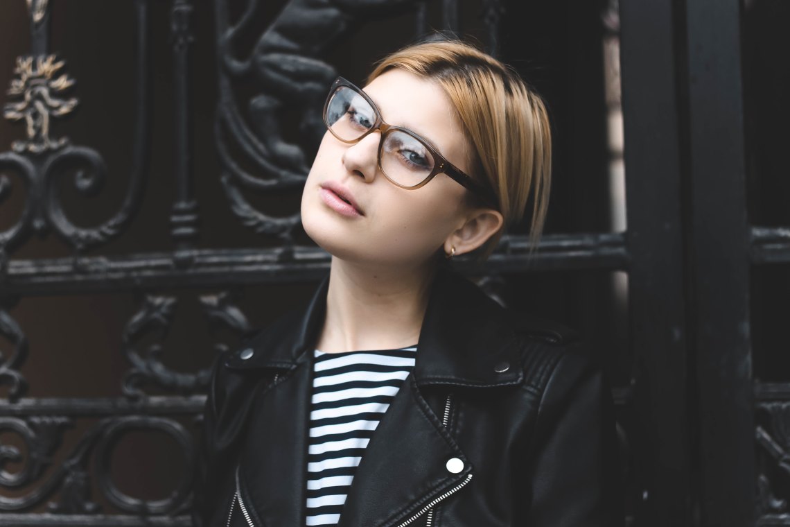 woman in glasses looking at camera