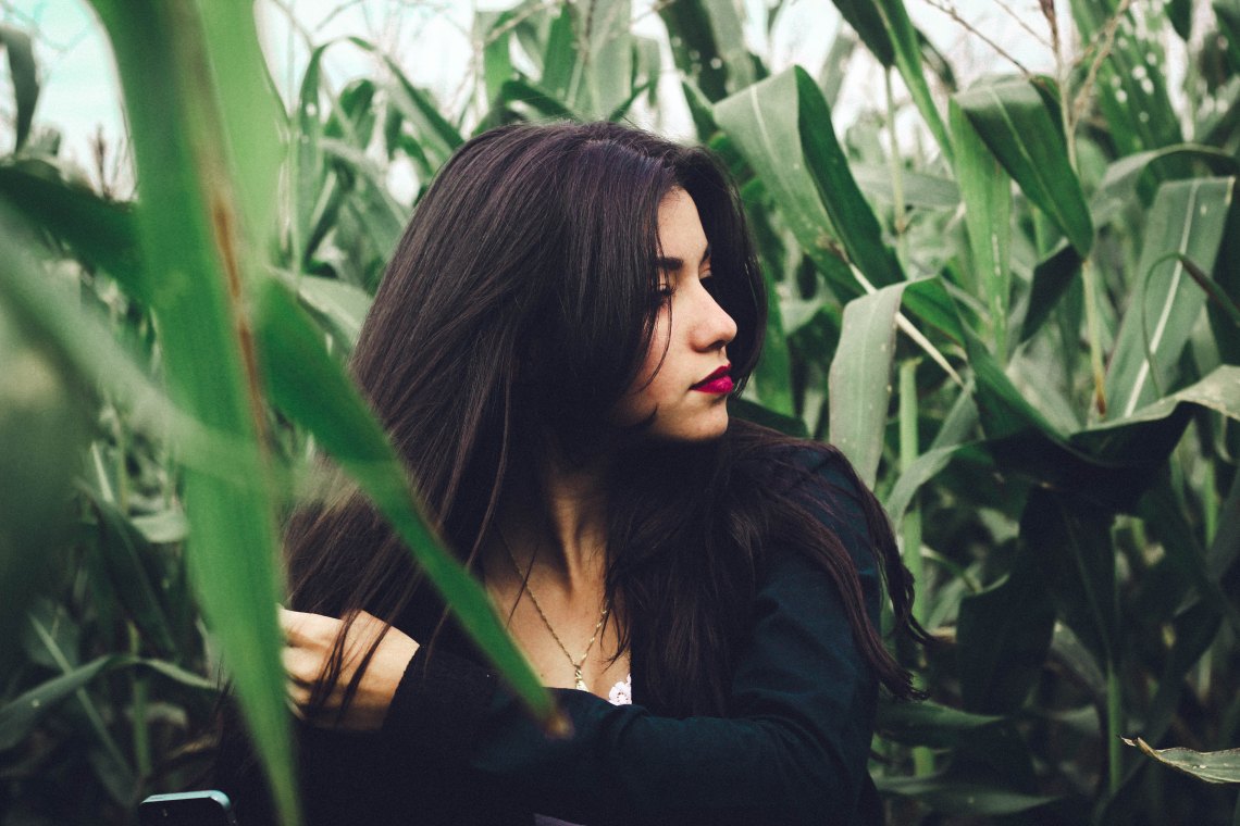 woman sitting in field