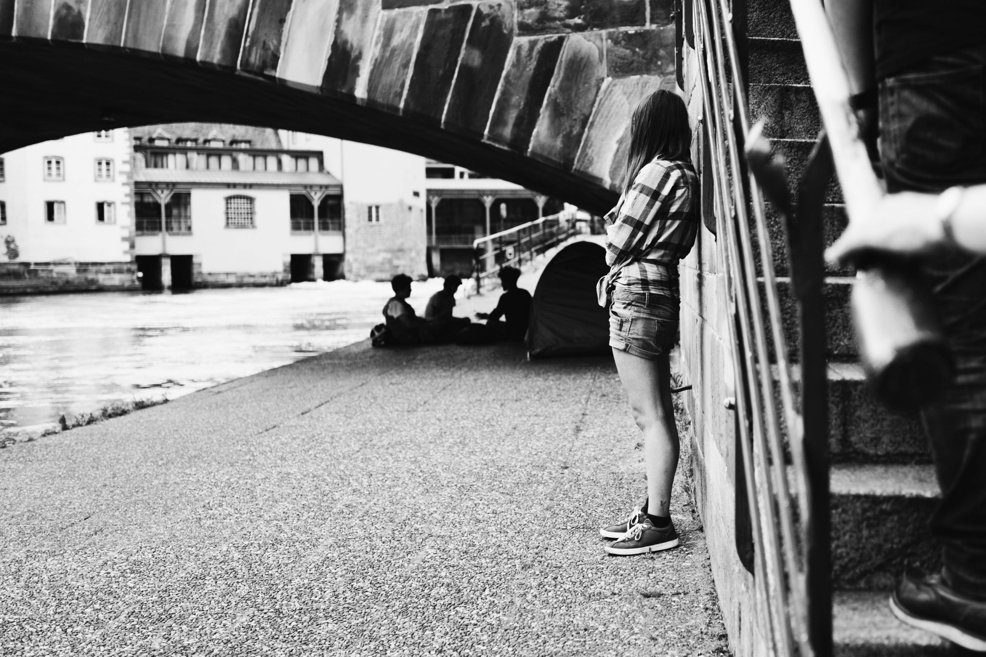 black and white girl under bridge