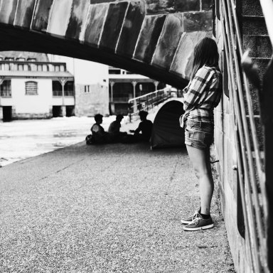 black and white girl under bridge