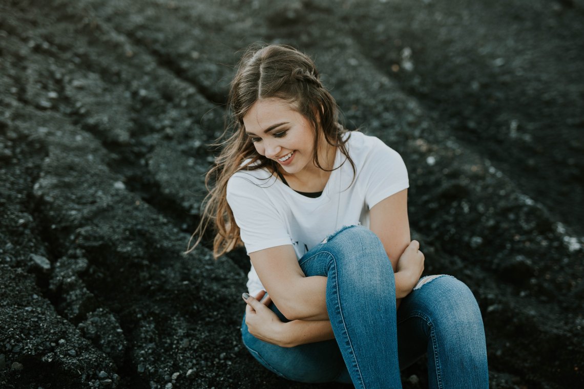 woman sitting in field