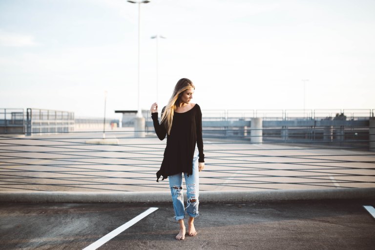 Woman standing in parking lot