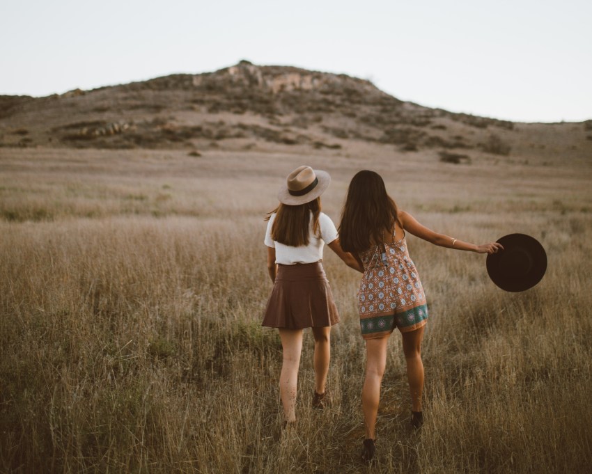 girls running in a field, dancing girls, country music, best love songs, best love songs in country music