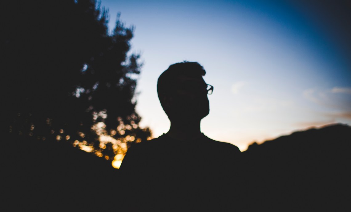 man looking at night sky