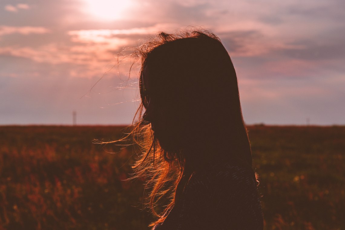 woman standing in field