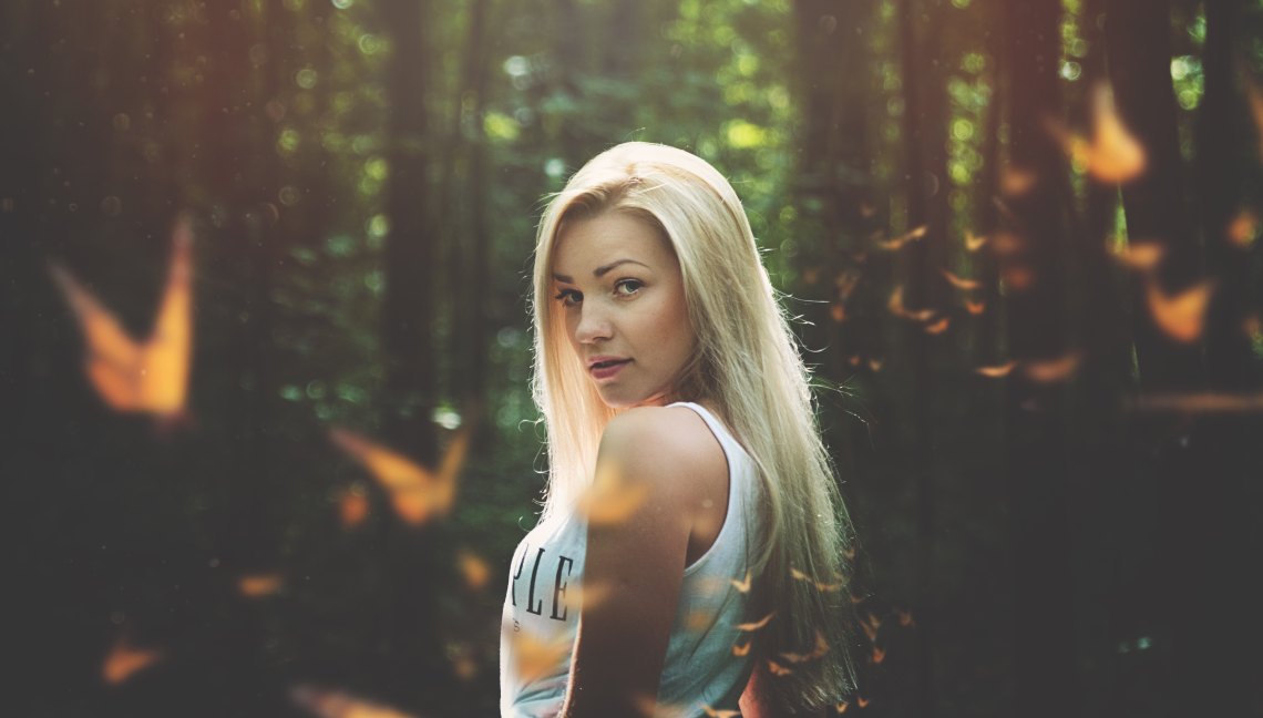 woman standing in forest