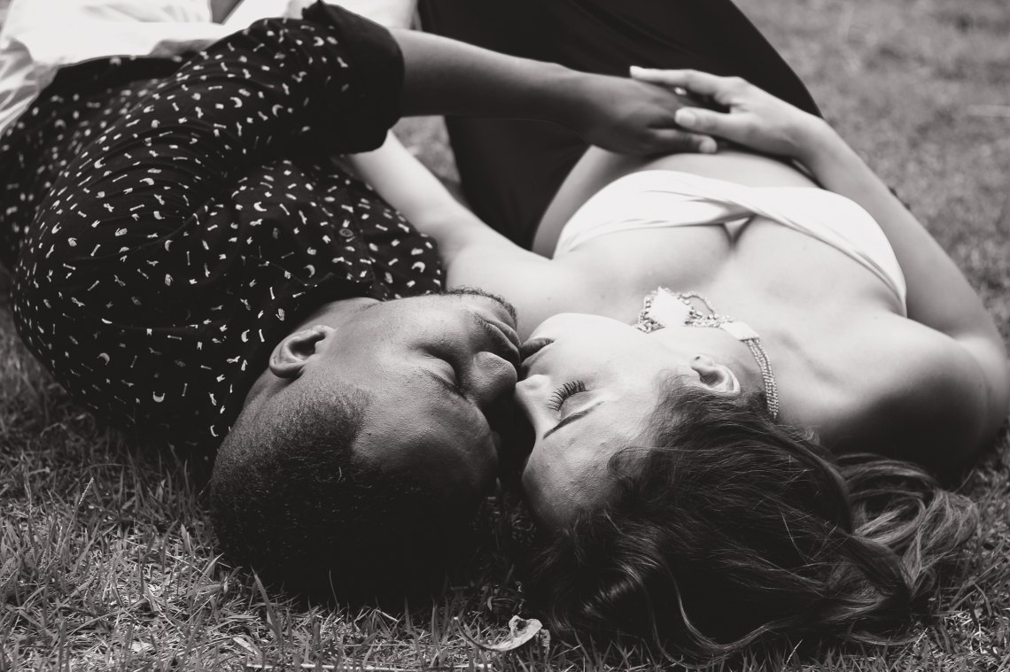 couple laying in grass
