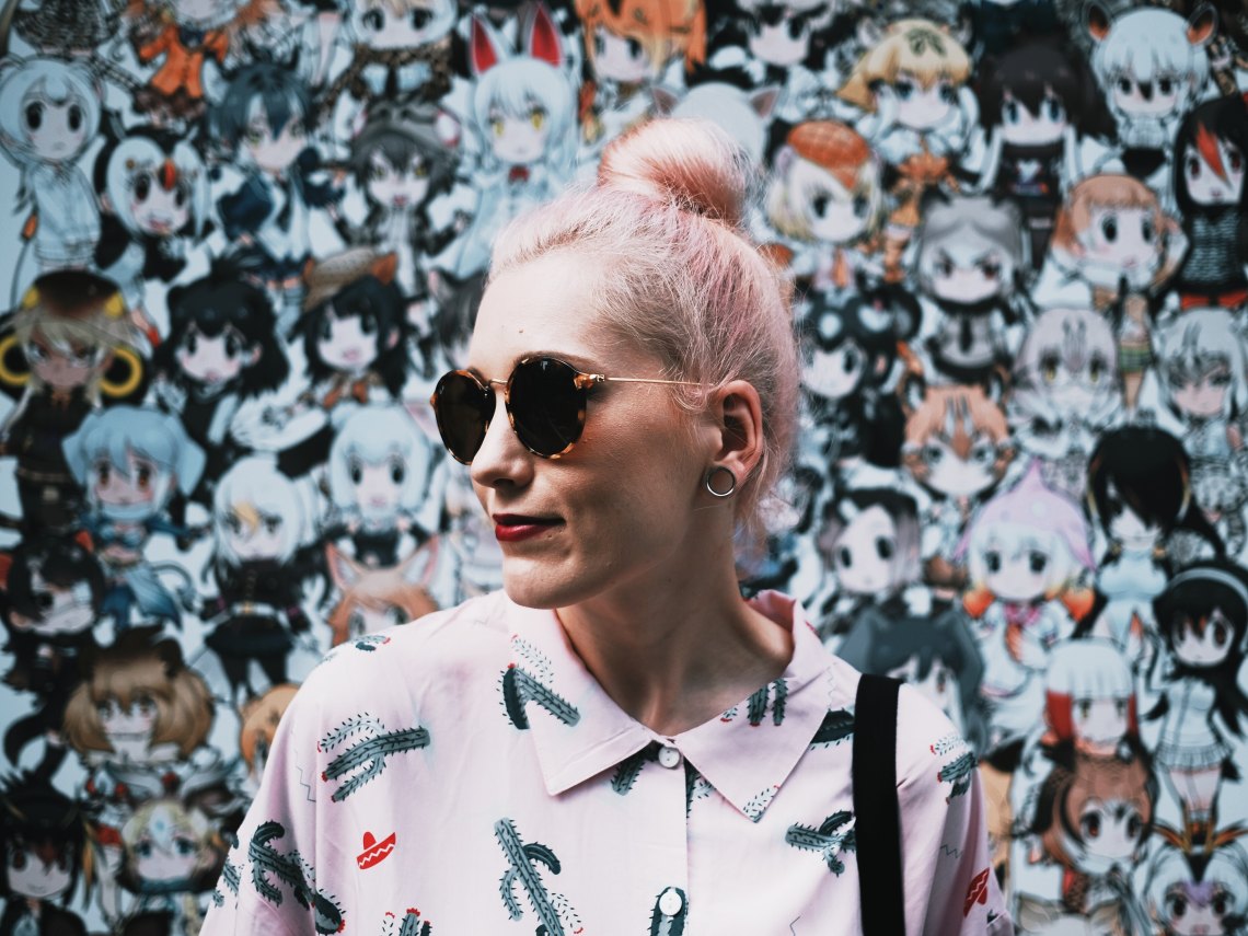 girl with sunglasses and bun