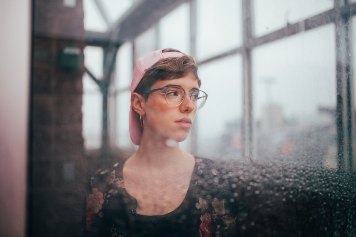 Woman with hat on overcast day