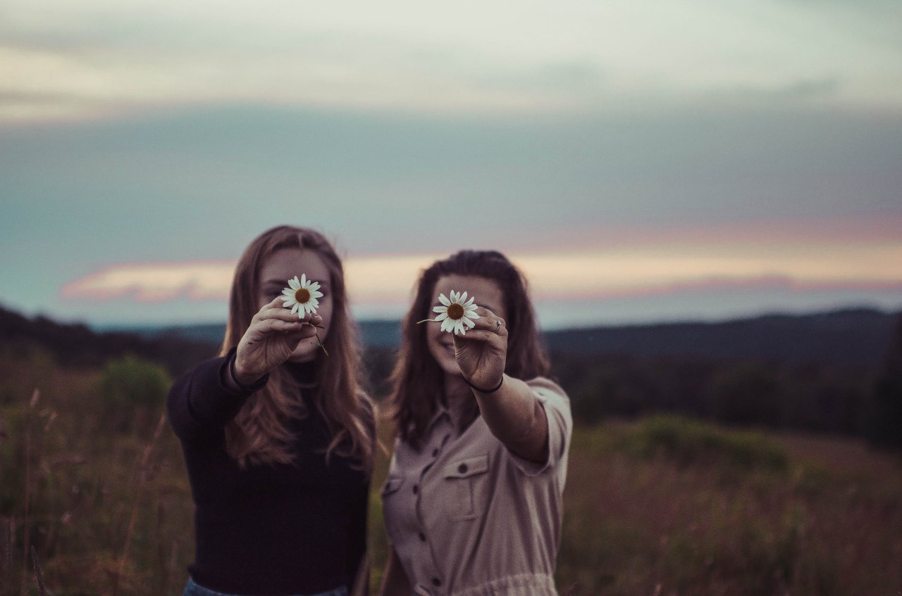 happy girls with flowers, bible verses about loving others, happy friends