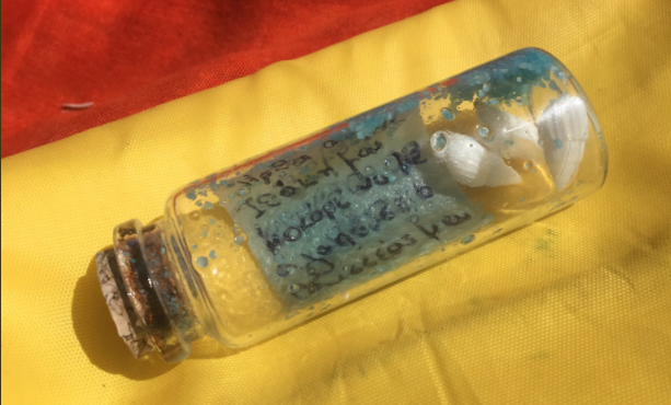message in a bottle found on the beach in greece