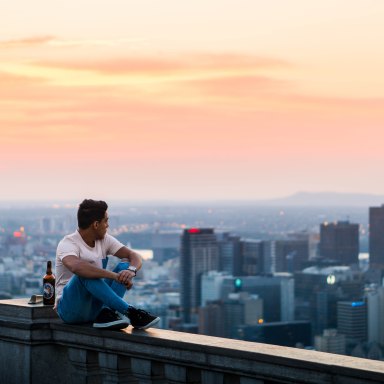 guy looking over city at sunset, endings, painful endings