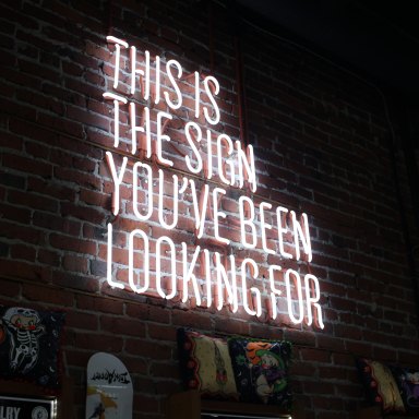 A neon sign that says "This Is The Sign You've Been Looking For"