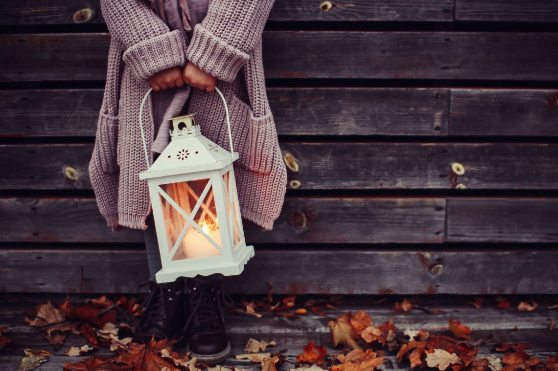 girl holding lantern