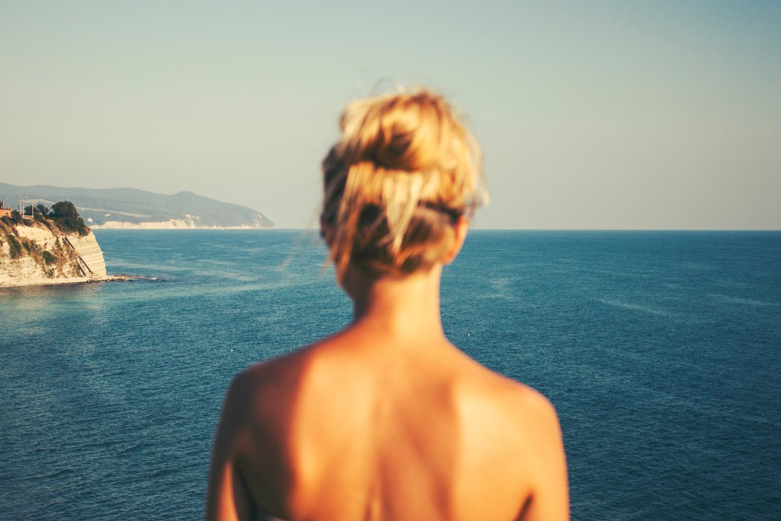 Woman standing over ocean