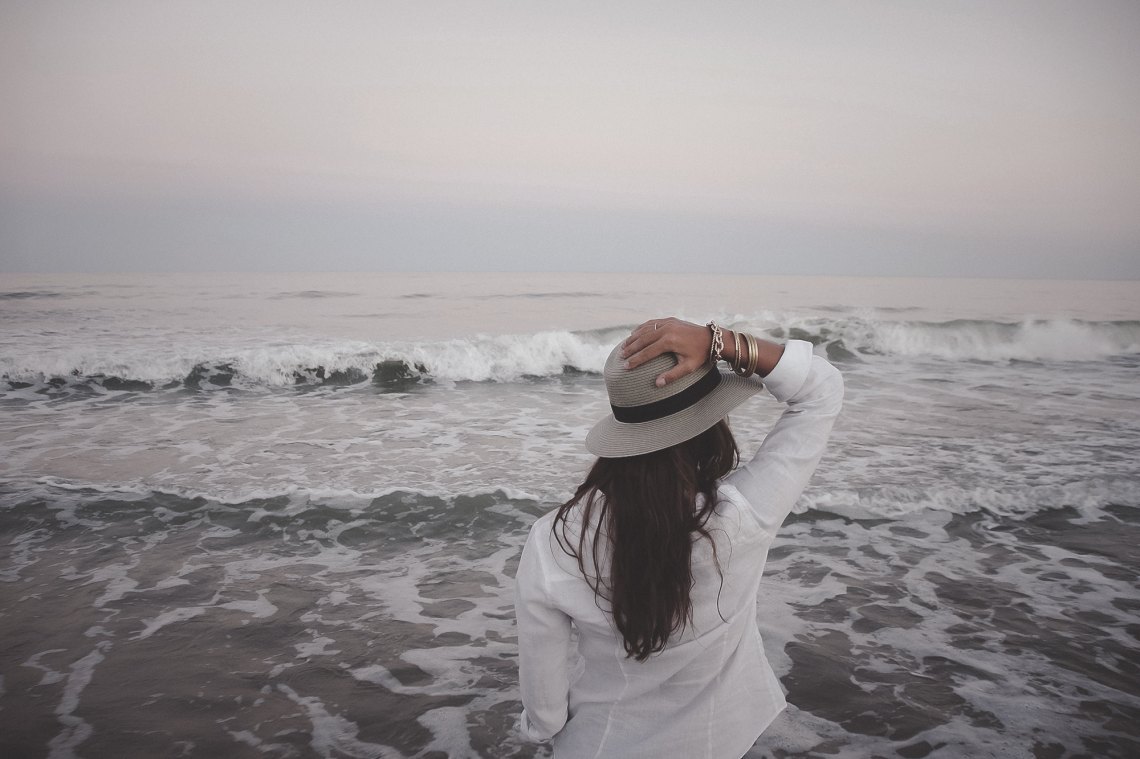 Woman standing in ocean