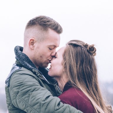 Guy kissing girl on forehead