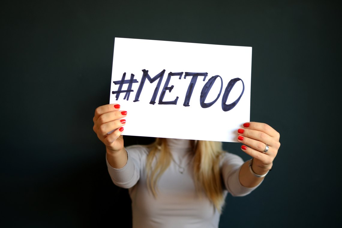 Woman holding up a #metoo sign