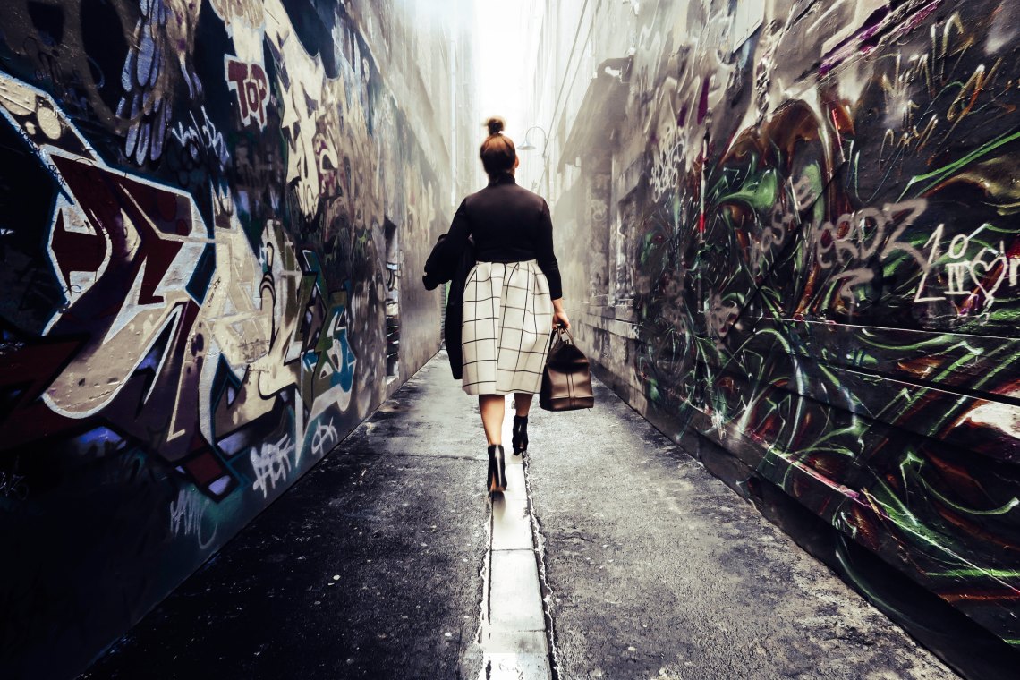 Professional woman in alley