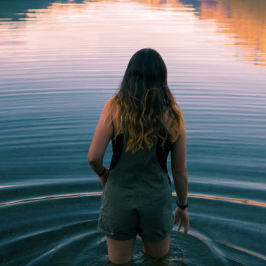 Woman walking through water