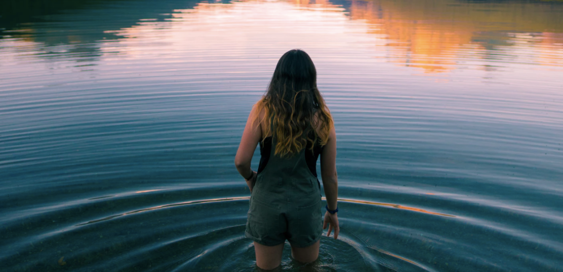 Woman walking through water