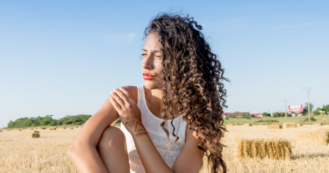Woman sitting in field