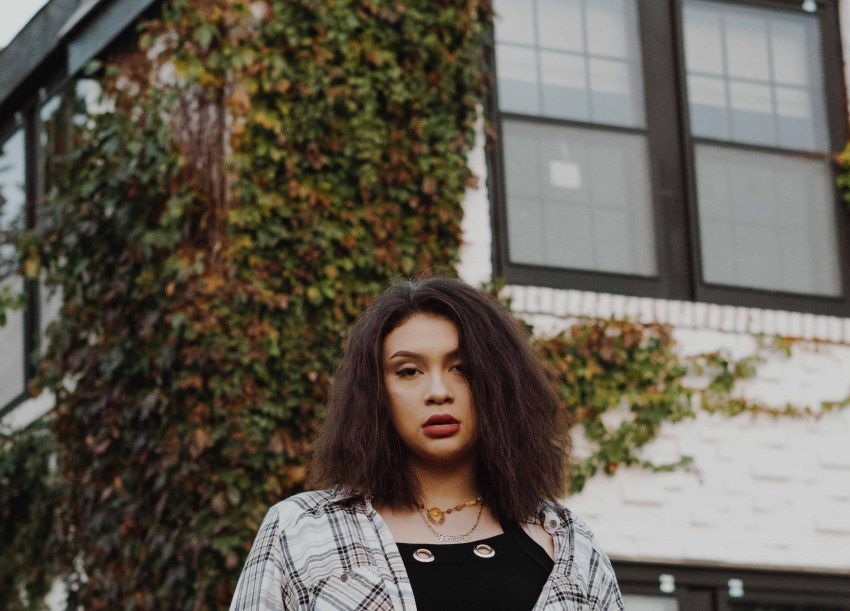 girl standing in front of building, being lost, finding yourself