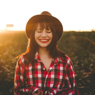 Woman smiling in flannel shirt