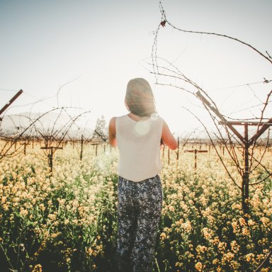 Girl standing in meadow