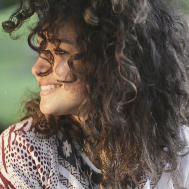 Woman smiling to side